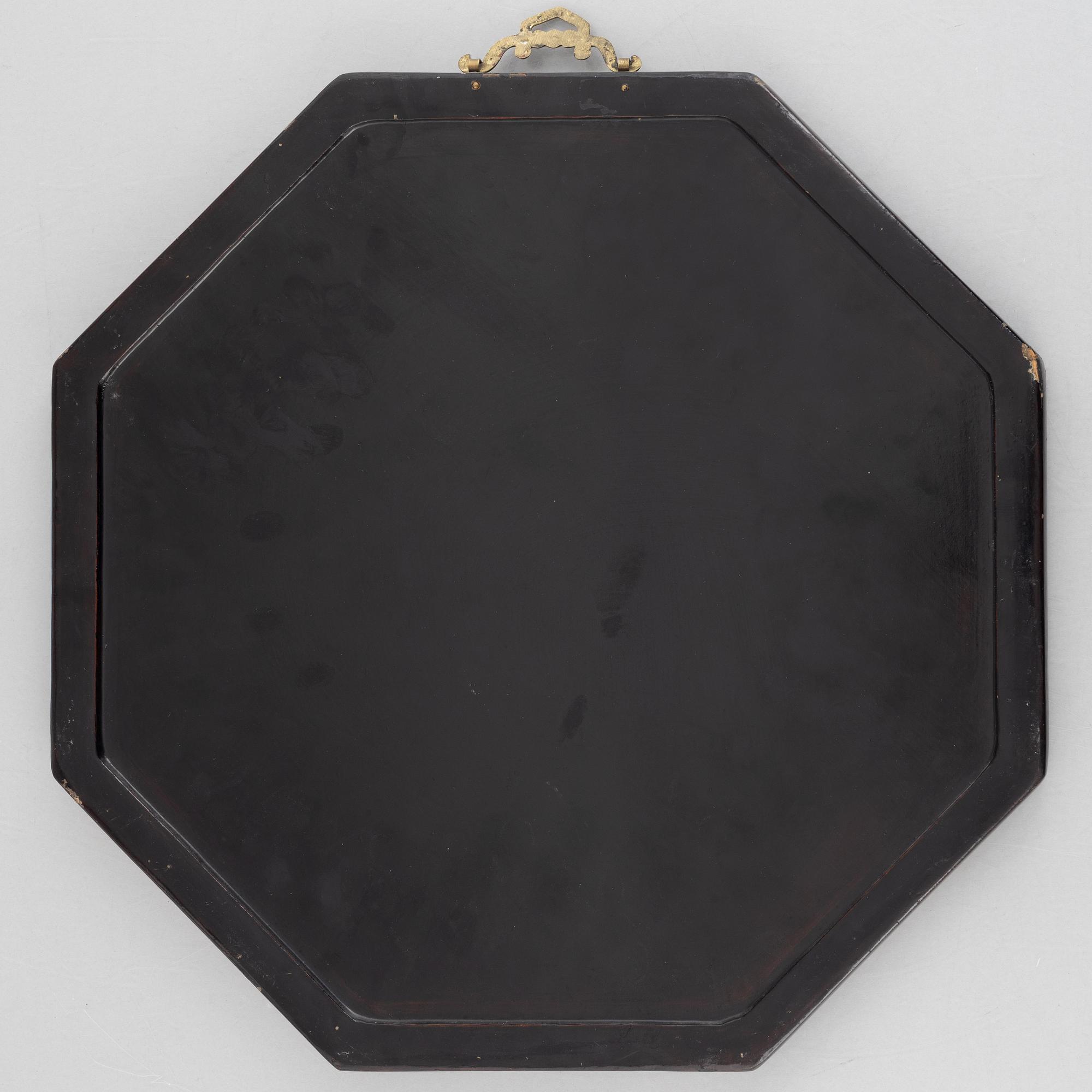 Four black-lacquered wall decorations, China, around 1900.