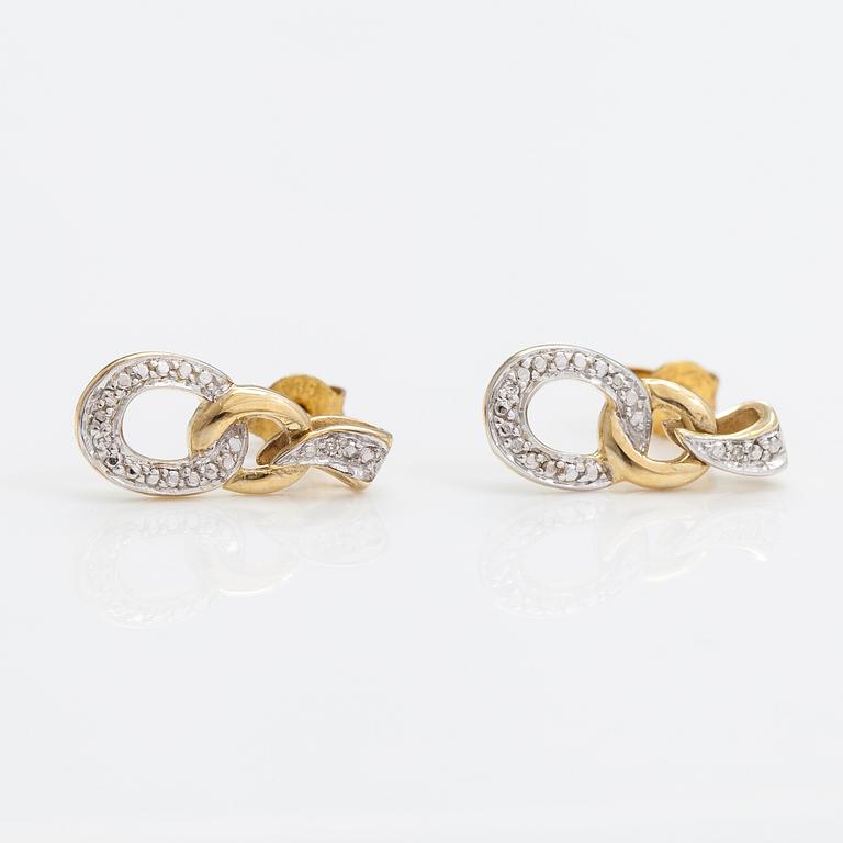 A pair of 14K gold earrings with diamonds ca. 0.01 ct in total.