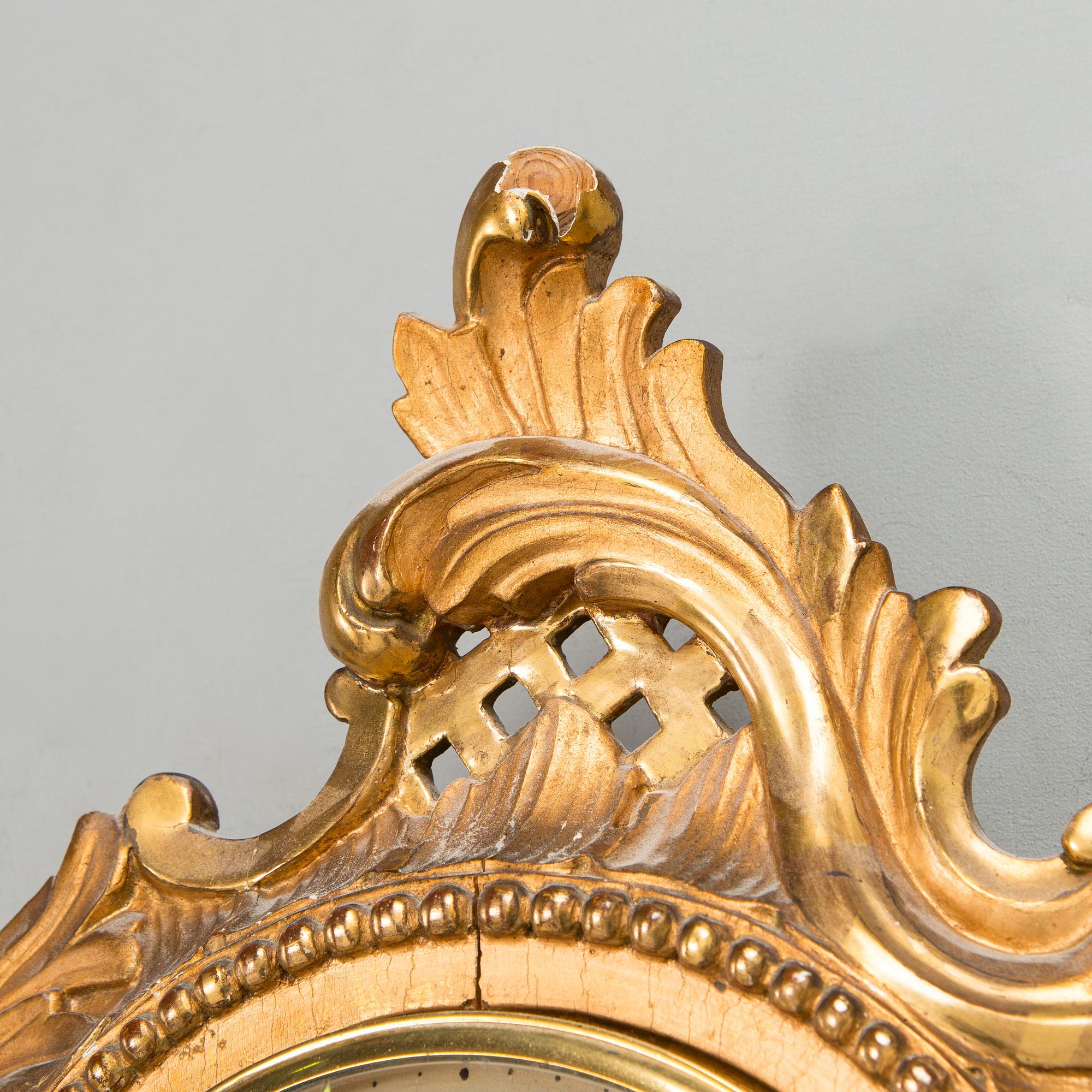A Rococo style wall clock from first half of the 20th century.