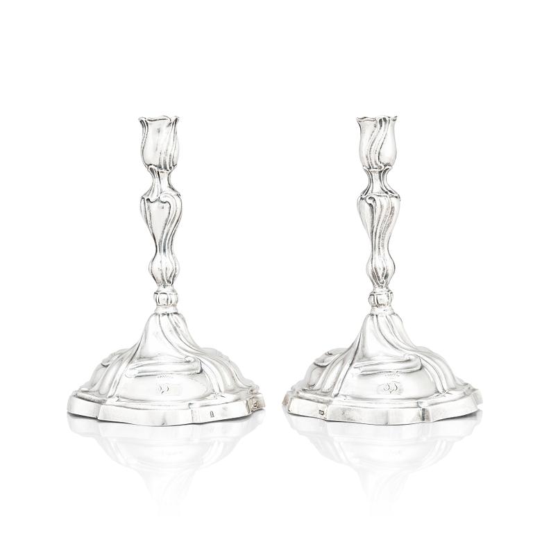 A pair of German silver rococo candle sticks, marks of Johann Balthasar Heckenauer, Augsburg (1775-1777).