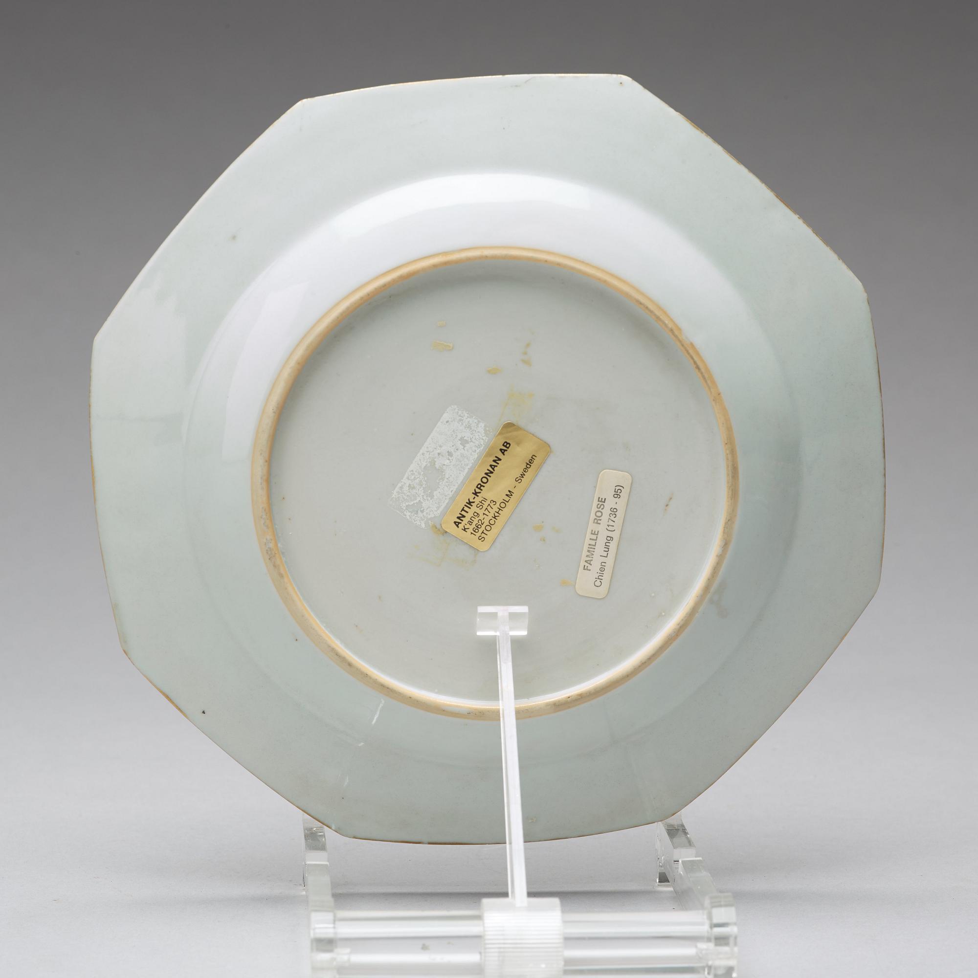 A set of four armorial dinner plates, Qing dynasty, Qianlong (1736-95).