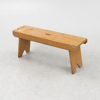 A painted bench, circa 1900.
