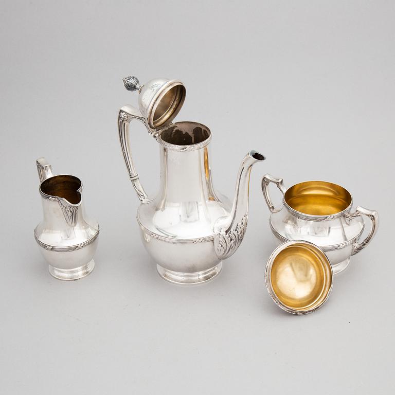 A Finnish Parcel-gilt Silver Art Nouveau Coffee Pot, Creamer and Sugarbowl, mark of Uusi Kultaseppä Oy, Helsinki 1912.