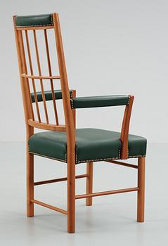 A Josef Frank cherrywood and green leather armchair, Svenskt Tenn, model 652.