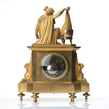 A Empire early 19th century gilt bronze mantel clock.