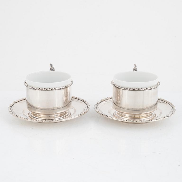 Silver tea mug holders with saucers, Pest, Austria, around 1900.