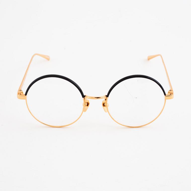 A pair of Linda Farrow glasses.