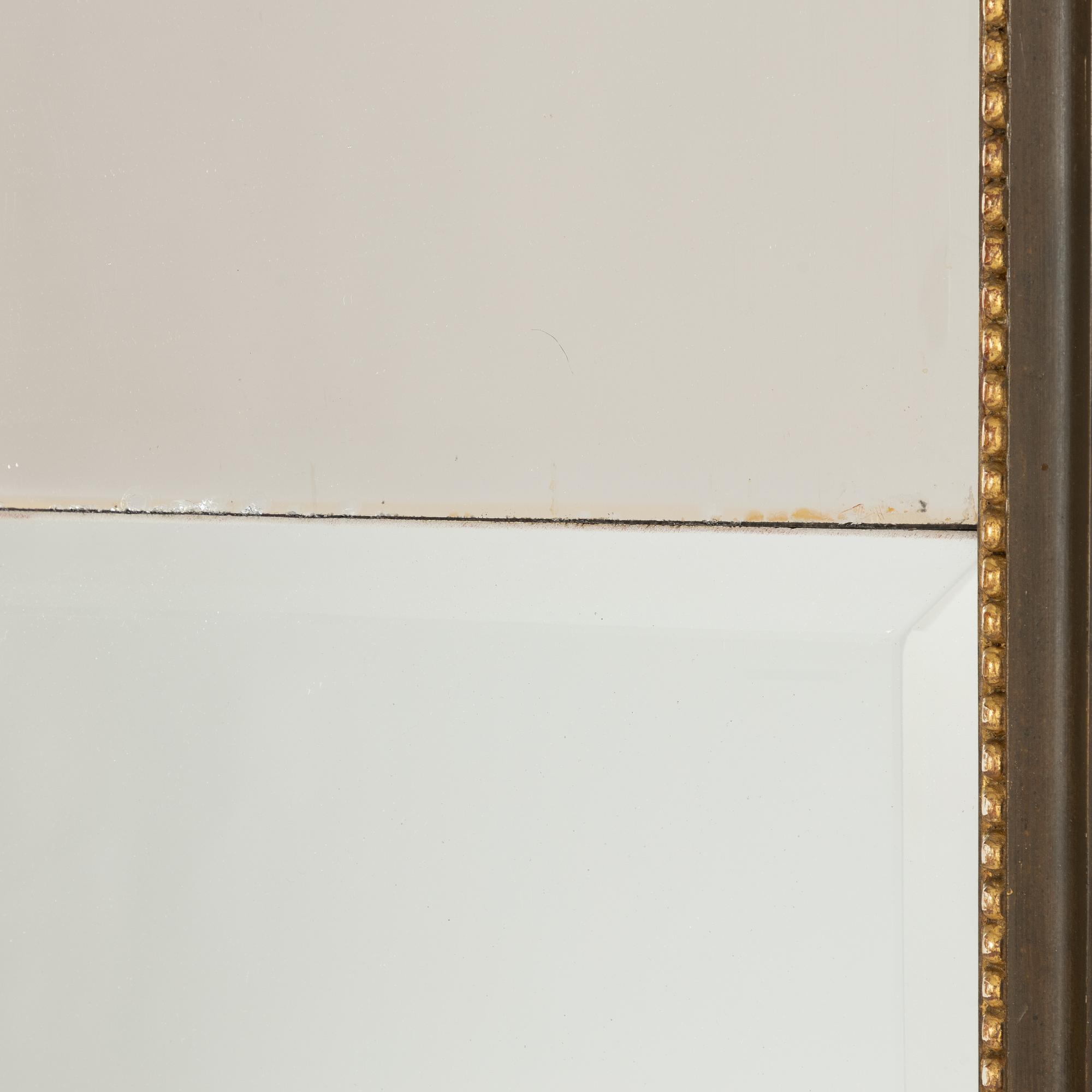 A Empire style mirror, late 19th Century.