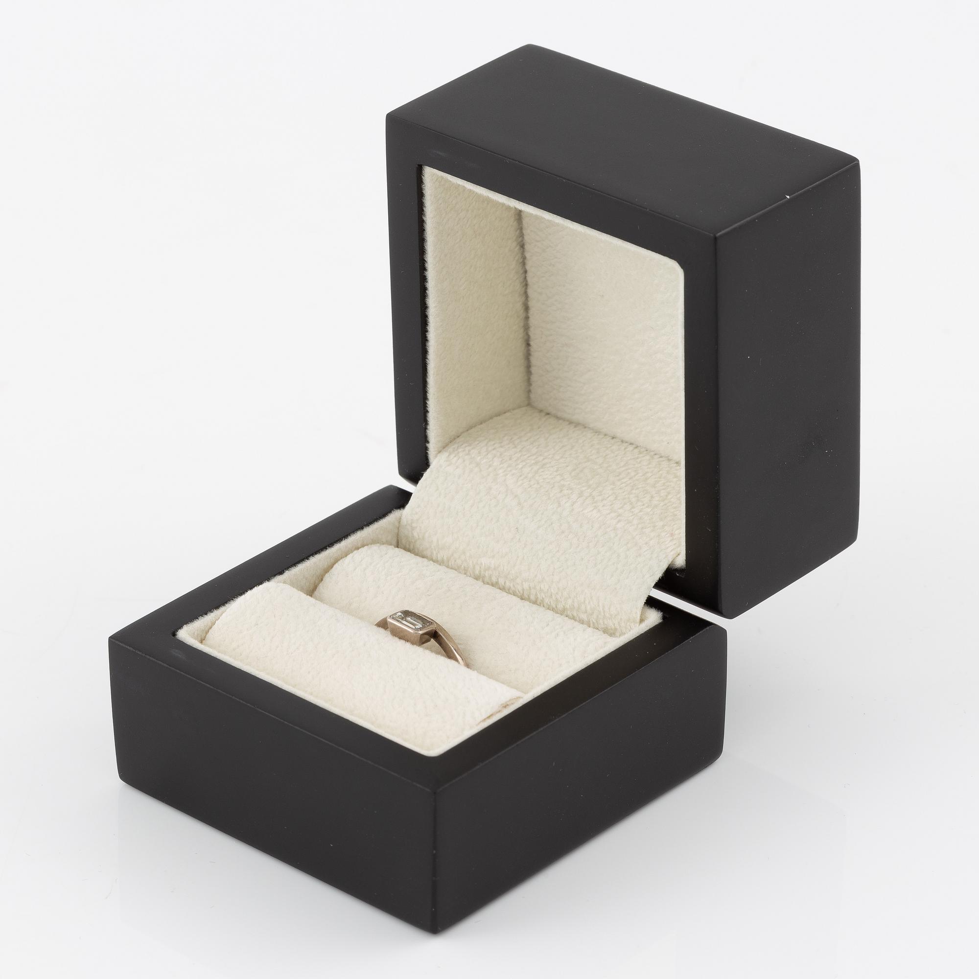 Ring, 14K white gold with emerald-cut diamond.