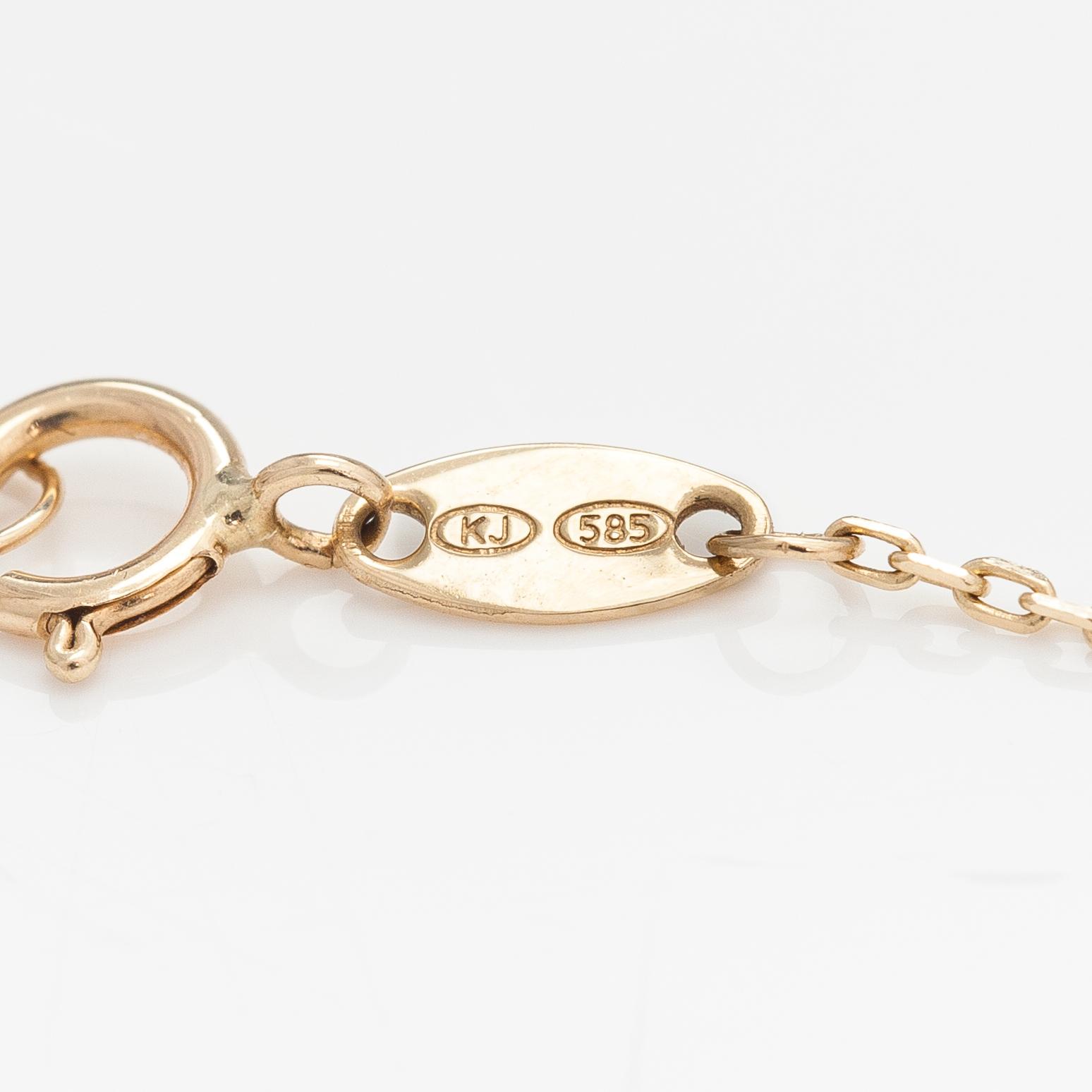 A 14K gold bracelet with a topaz. Kultajousi, Helsinki.