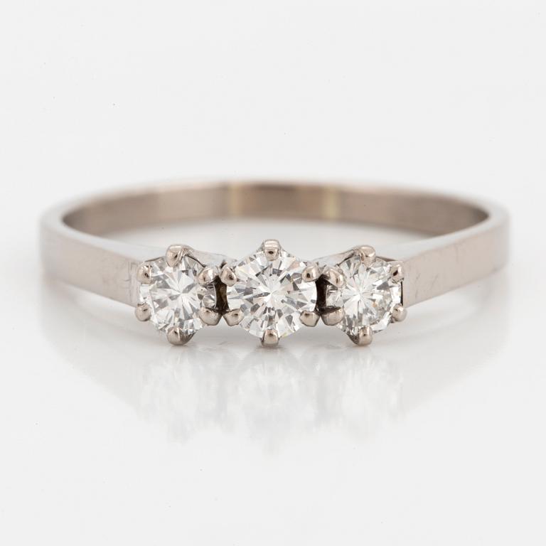 A threestone 18K white gold and brilliant-cut diamond ring.