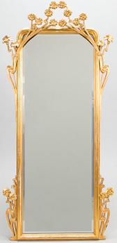 An Art Nouveau mirror with console table from early 20th century.