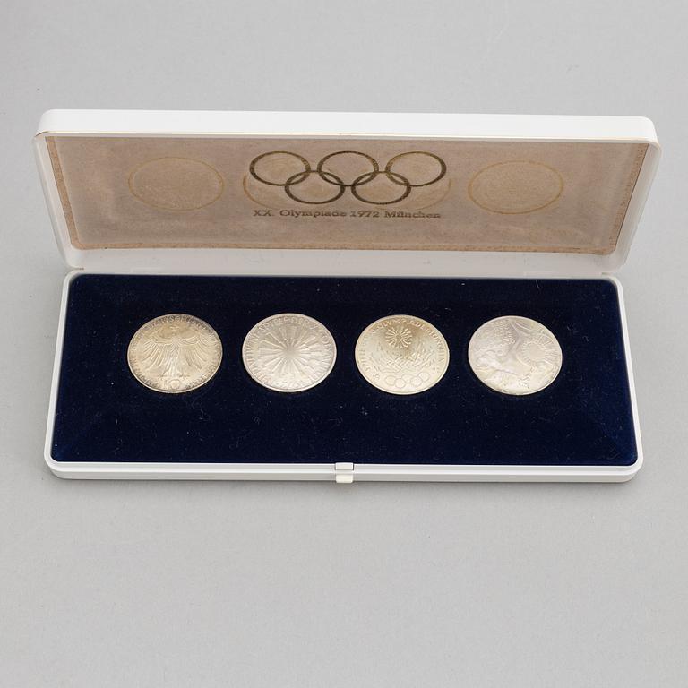 Olympic memorabilia: A teddy bear and four silvercoins from the 1972 games in Munich.