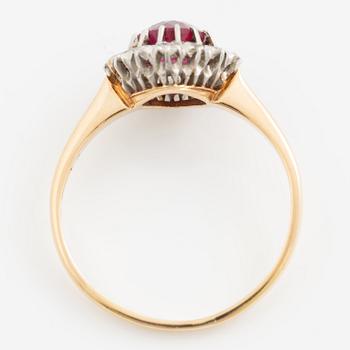 Ring in 18K gold set with a faceted synthetic ruby and eight-cut diamonds.