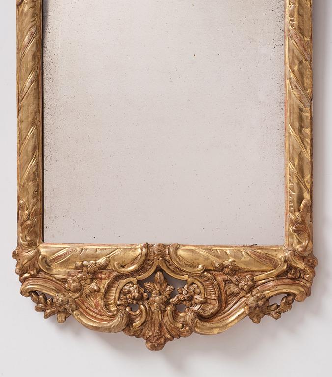 A Swedish rococo giltwood mirror, later part of the 18th century.