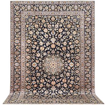 A signed Kashan carpet, c. 410 x 270 cm.