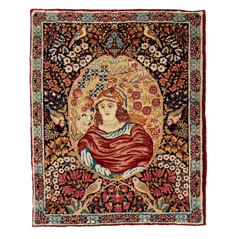 A RUG. A semi-antique Kerman Laver figural. 79,5 x 63 cm.