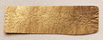 A set of nine presumably modern Egyptian-style gold foil sheets with figures and hieroglyphs.