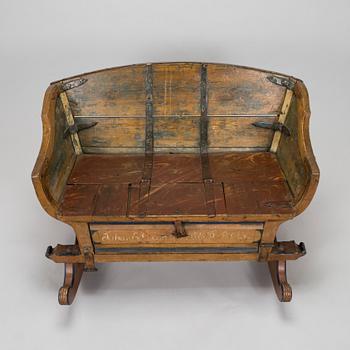A 19th-century wooden sleigh.