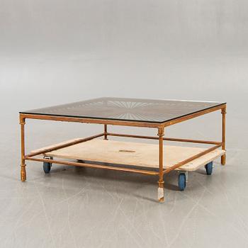 A late 20th century metall and glass coffee table.