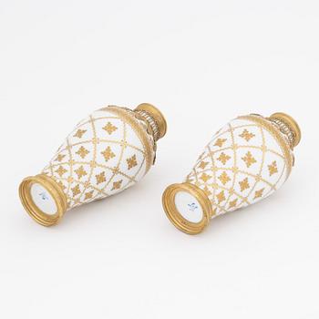 A pair of brass-mounted porcelain  vases, Sèvres mock marks, around 1900.