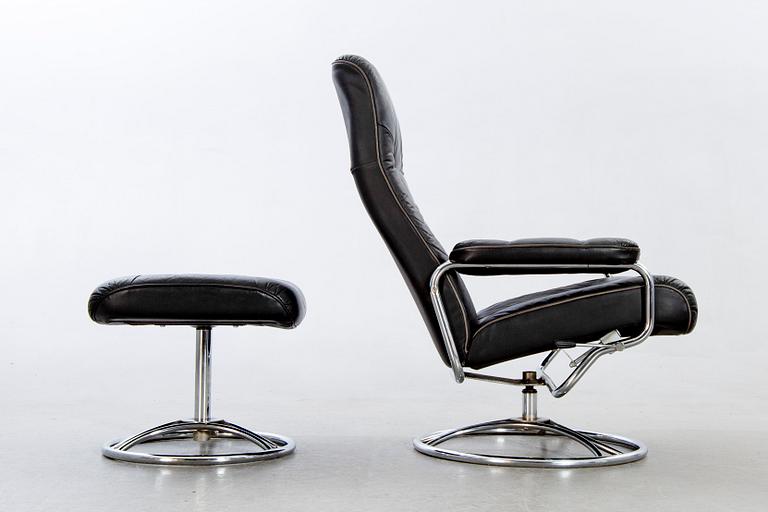 A leather swivel armchair and stool, Söderbergs  1980s.