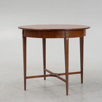 A mahogany veneered table, late 19th century.