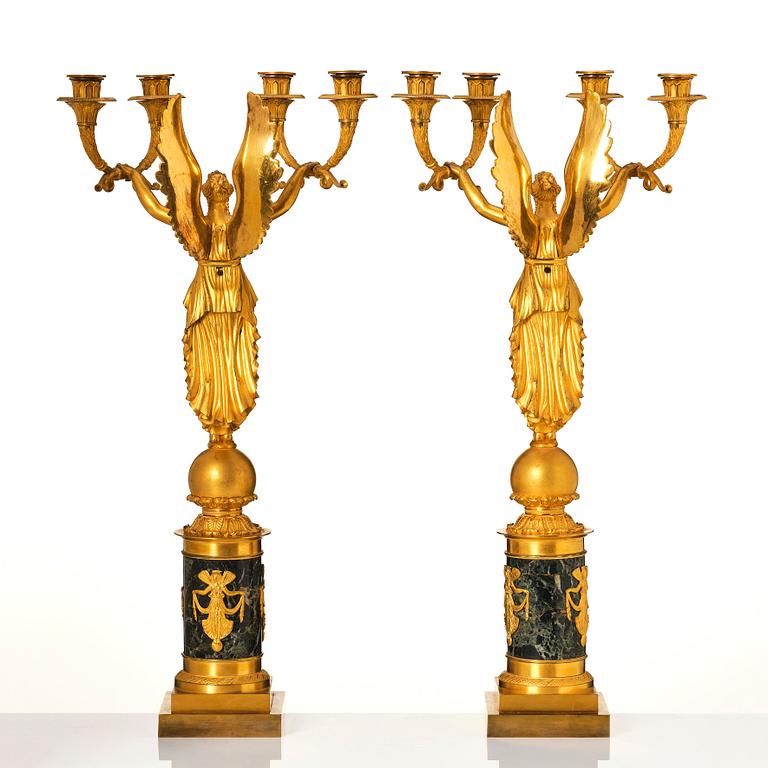 A pair of French Empire four-light candelabra, attributed to Francois Rabiat (bronze maker in Paris 1756-1815).