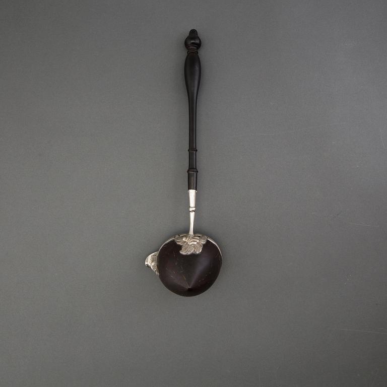 A silver and coconut rococo soup spoon, Sweden 18th century, marked LS.