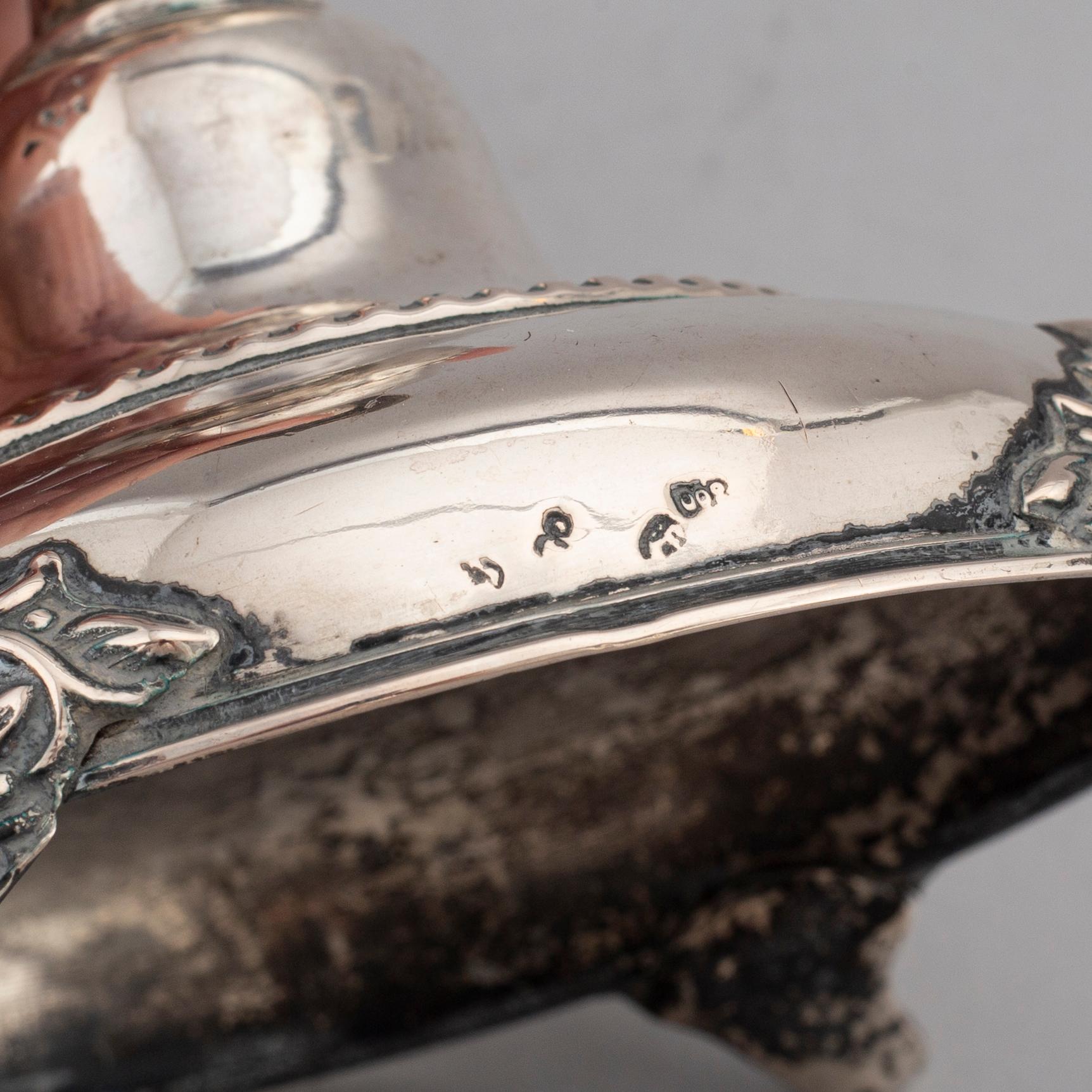 A pair of silver candlesticks, circa 1900.