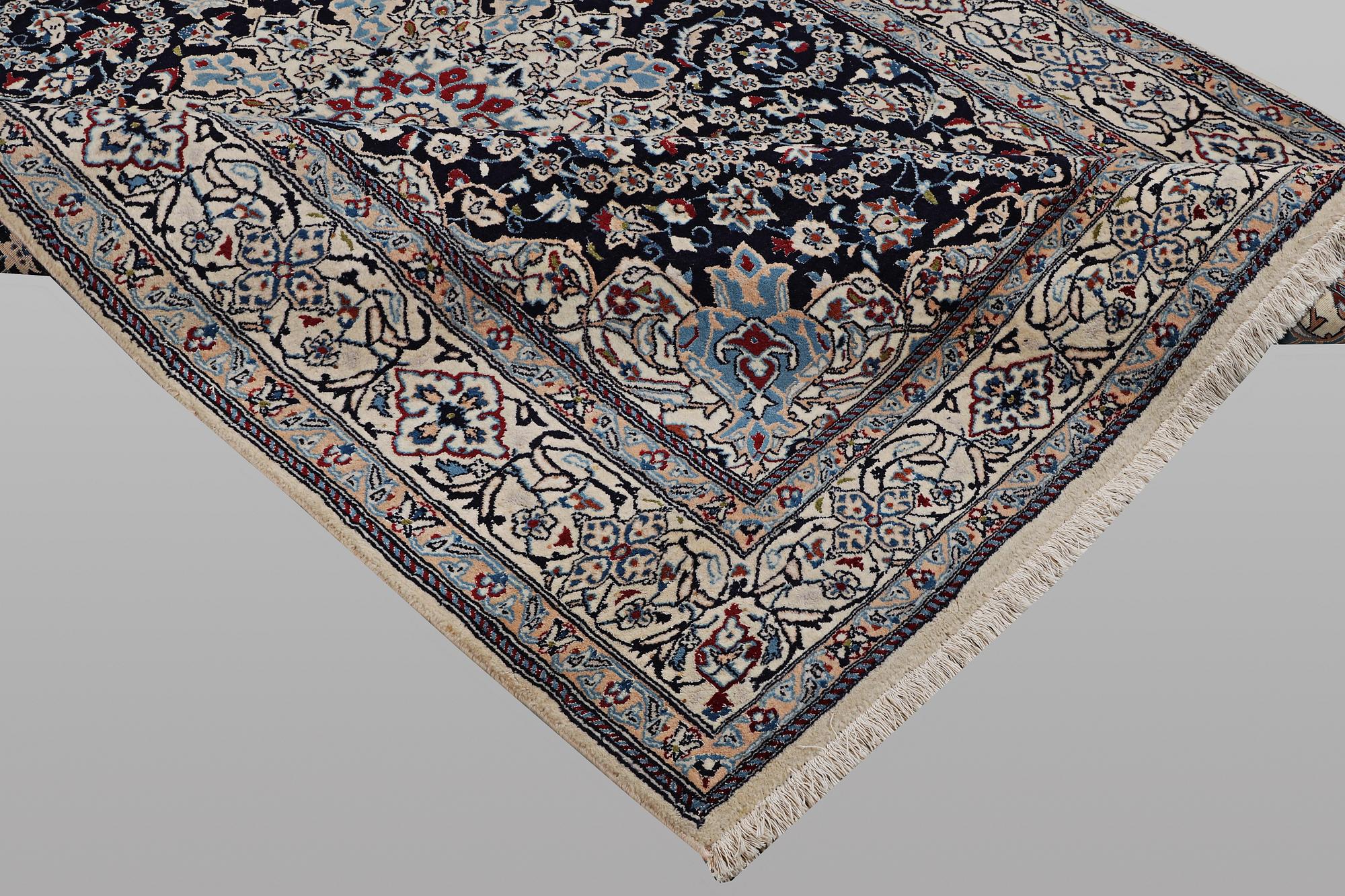 A carpet, Nain, part silk, 9 Laa, ca 295 x 197 cm.