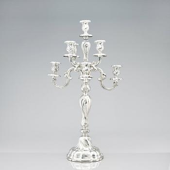 A pair of eight-light Louis XV-style silver candelabra, mark of Hermann Julius Wilm, Berlin, circa 1900.