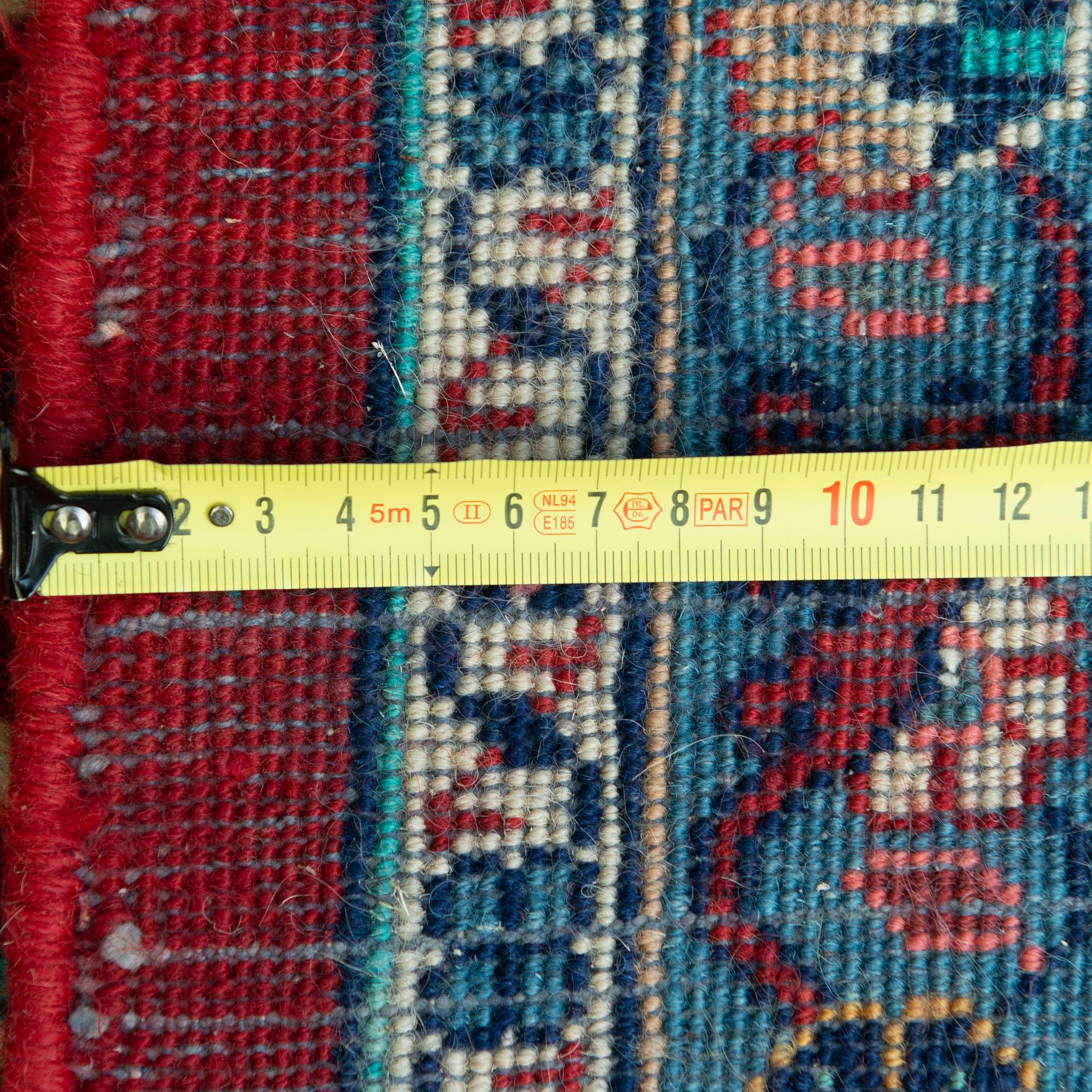 A carpet from Turkey. Circa 383x277 cm.