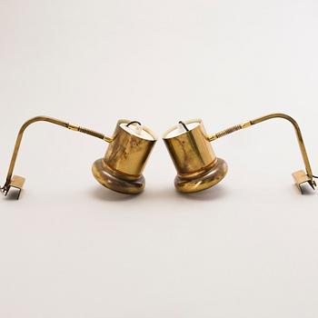 KAI RUOKONEN, A pair of brass wall lamps.