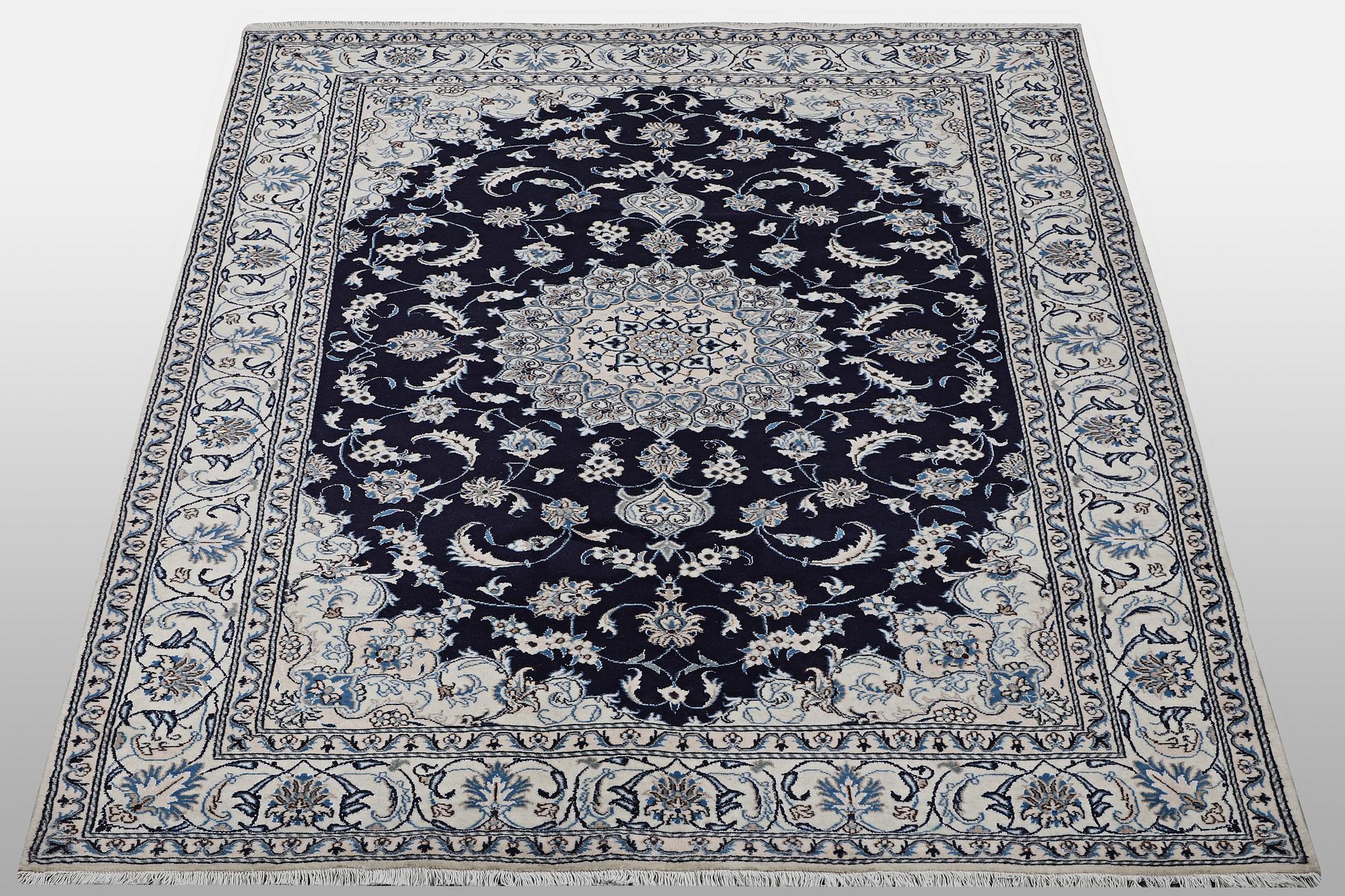 A carpet, Nain, part silk, ca 310 x 205 cm.