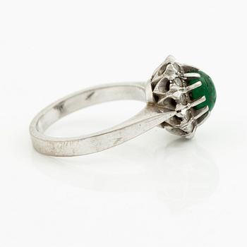 Ring, 18K white gold with cabochon-cut emerald and brilliant-cut diamonds.