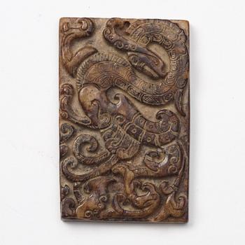 A group of three archaistic Chinese stone bi discs and two pendants.