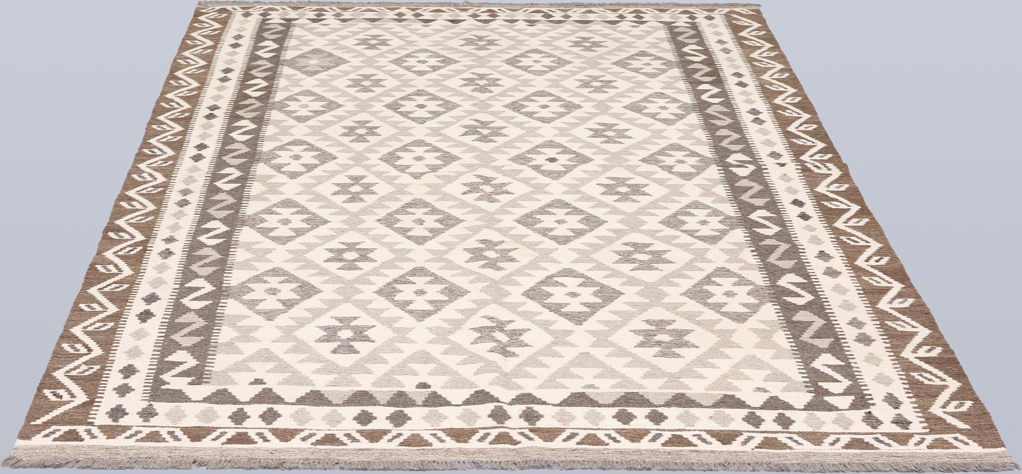 A Kilim rug, approx. 240 x 172 cm.