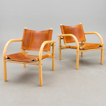 A pair of 1980s ' 411' armchairs for Artek, Finland.