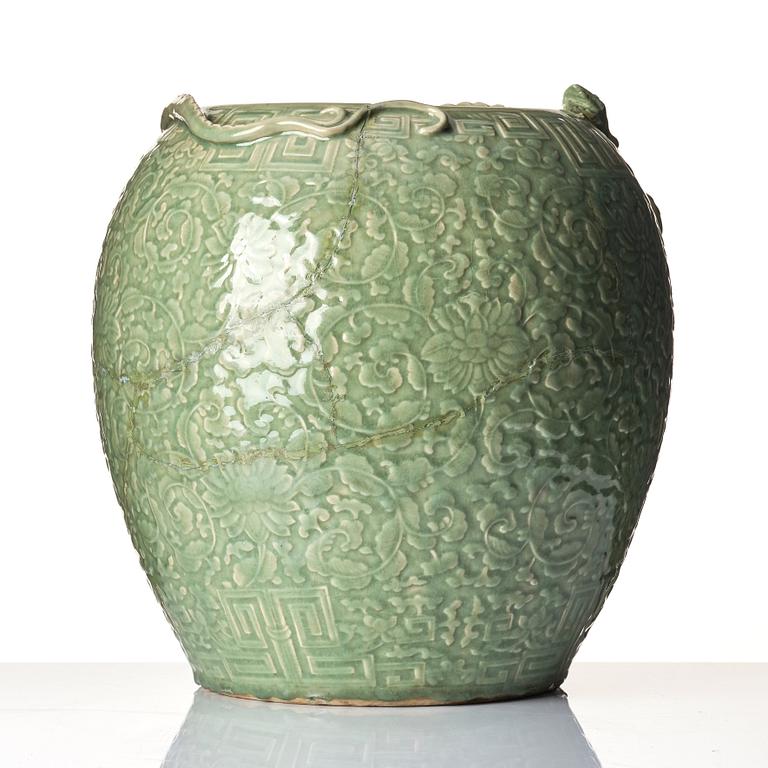 A large celadon 'lotus and qilong' vase, Qingdynasty, 19th century.