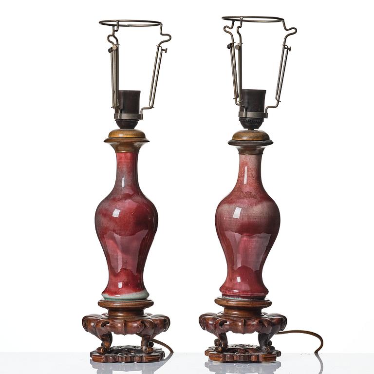 A pair of sang de boef glazed vases, Qing dynasty, 19th Century.