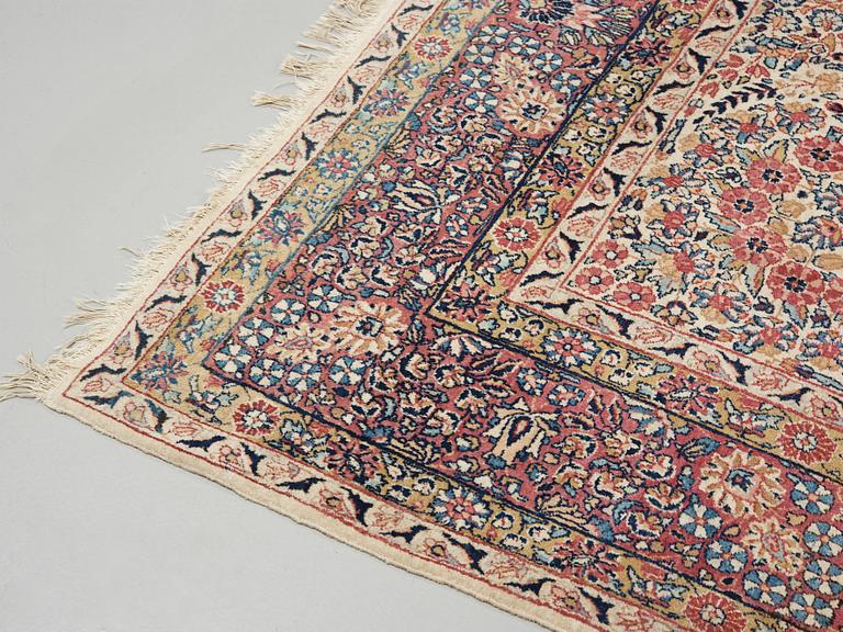 A semi-antique/old Kerman carpet, around 361 x 264 cm.