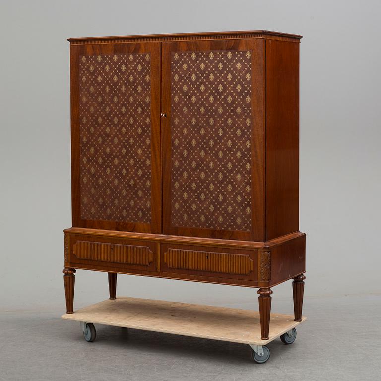 a mid 20th century mahogany cabinet.