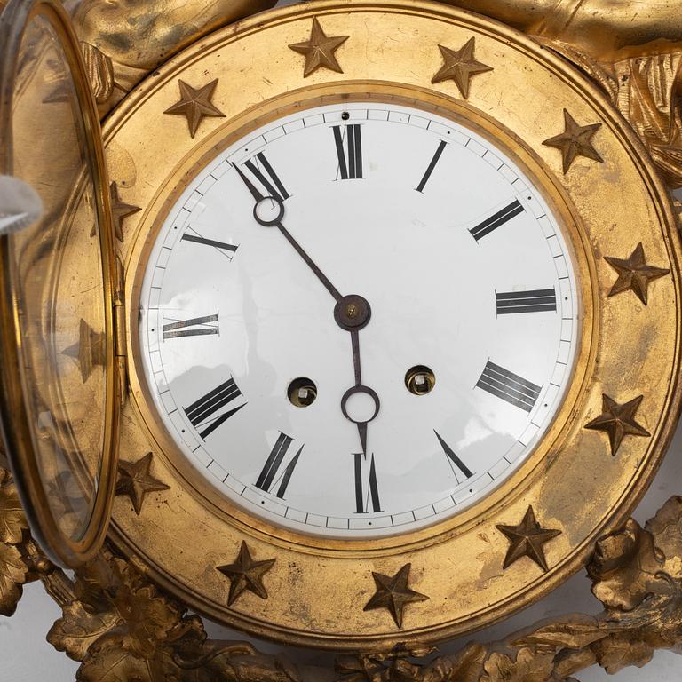 An Empire wall clock, 19th Century.