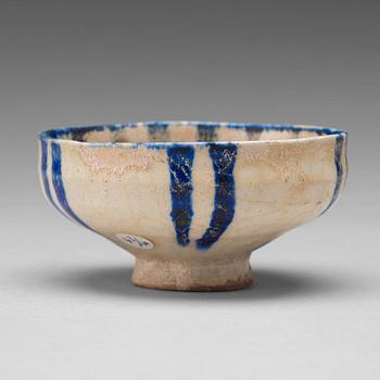 175. A BOWL, pottery with a white slip and underglaze blue decor, diameter ca 10 cm, Kashan, Persia/Iran early 13th century.