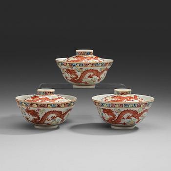 66. A set of three famille rose bowls with covers, Qing dynasty with Guangxu six character marks and period (1874-1908).