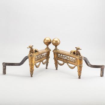 A pair of Louis XVI 18/19 century fire dogs.