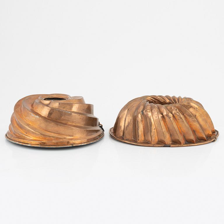 Four copper cake moulds. 18th and 19th Century.