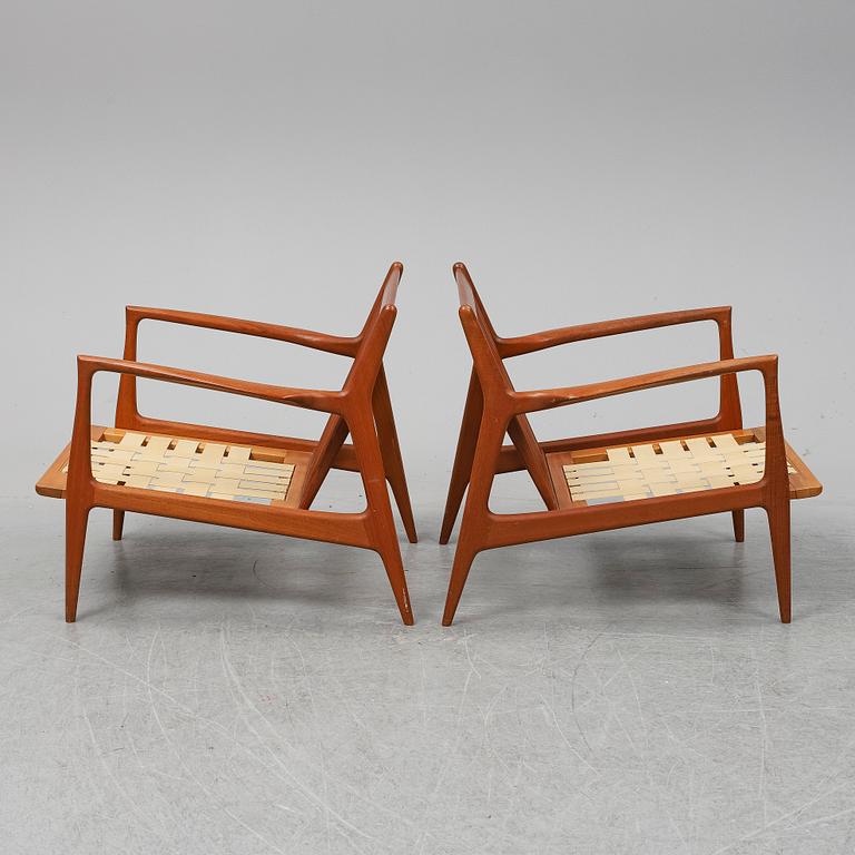 A pair of late 20th Century easy chairs.