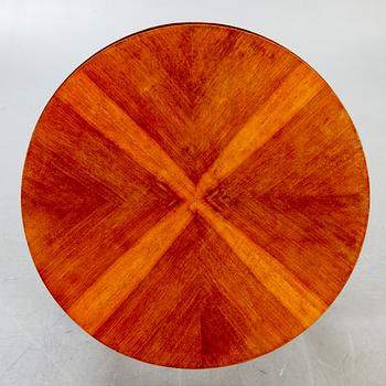 An Art deco style walnut coffee table alter part of the 19th century.